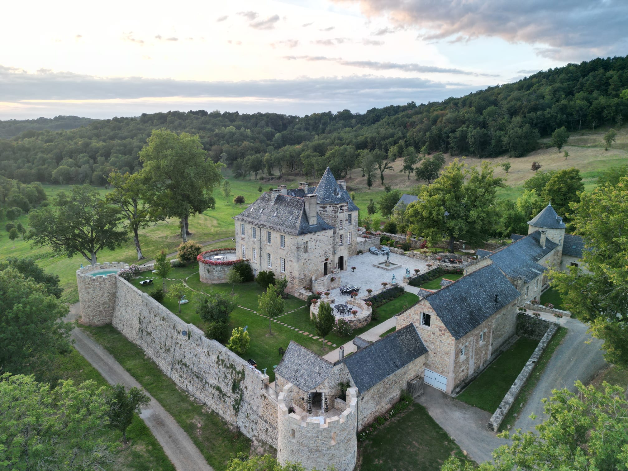 Close aerial view of the château, stone ramparts and towers